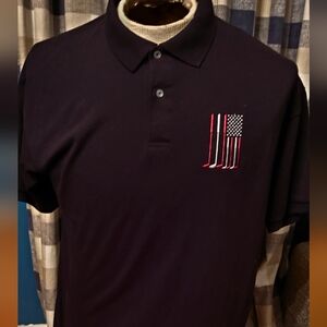 Mens Large Black polo.  Golf flag logo embroidered